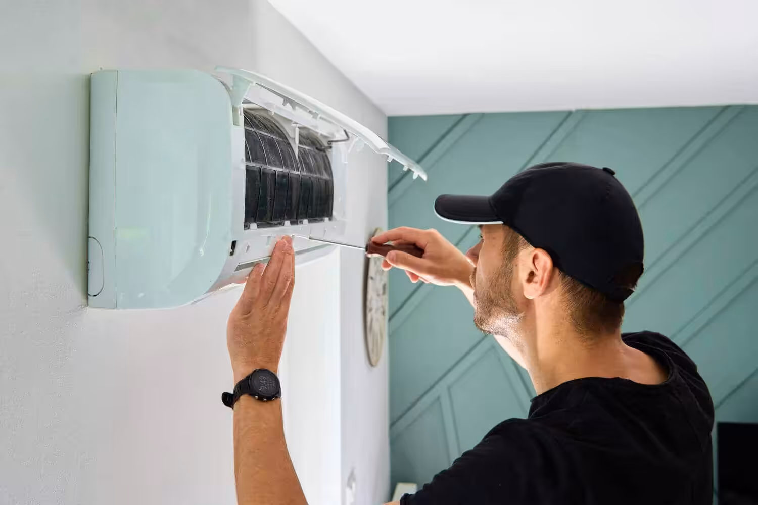 Technician repairing air conditioning unit