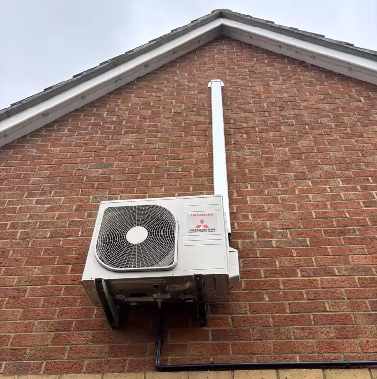 Air conditioning unit on brick wall