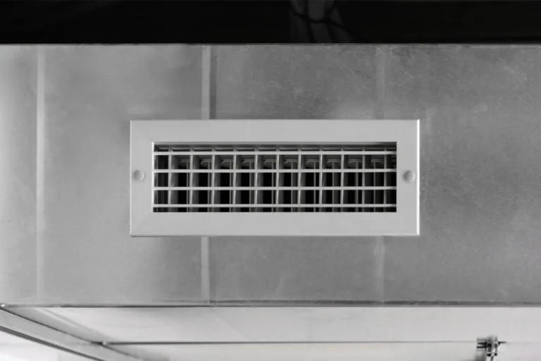 Rectangular wall air vent grille on tiles