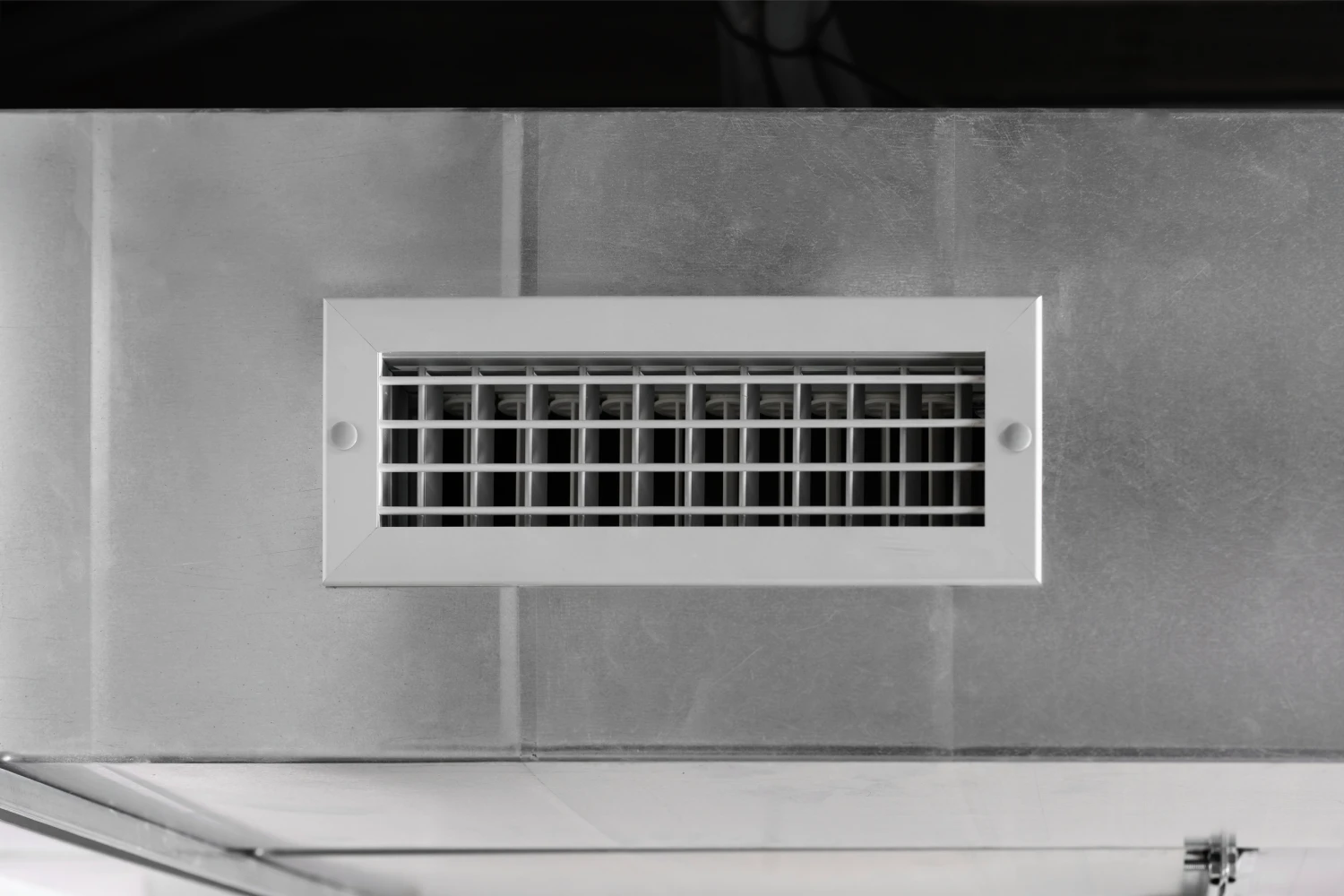 Rectangular wall air vent grille on tiles